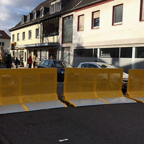 3 units of a vehicle barrier blocking the road
